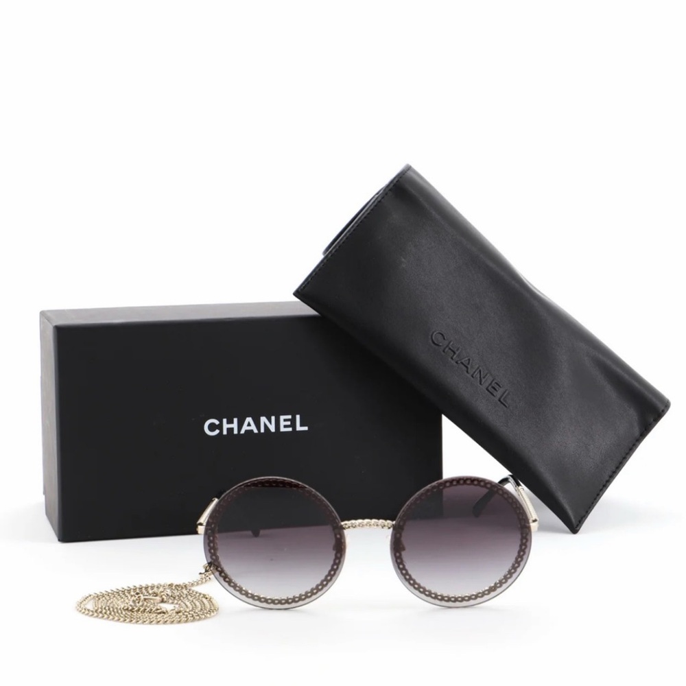 CHANEL Black and Gold Sunglasses with Chain Accent